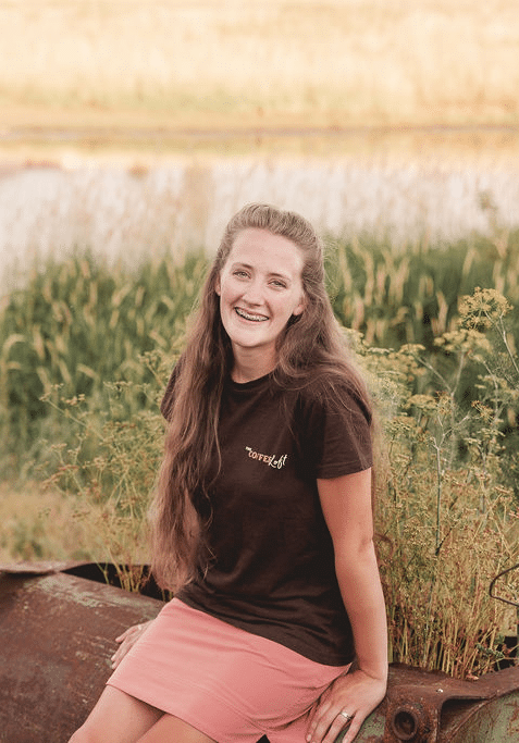 Amy Manley, CEO of the Coffee Loft, sitting and smiling at the camera