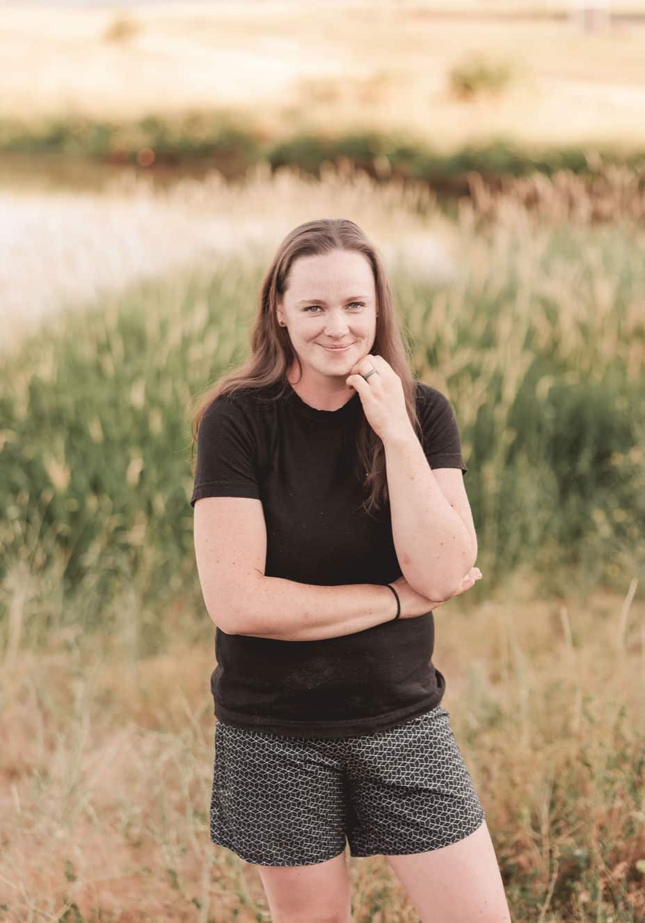 Anna standing and smiling at the camera